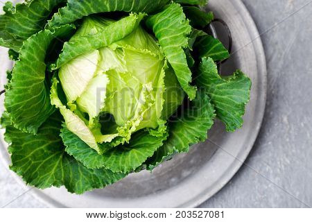 Fresh Green Cabbage In Metal Plate On Grey Background. Top View. Copy Space.