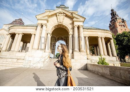 Portrait of a young woman tourist on the Haken terrace traveling in Szczecin city in Poland