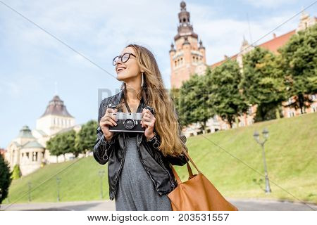 Portrait of a young woman tourist on the Haken terrace traveling in Szczecin city in Poland