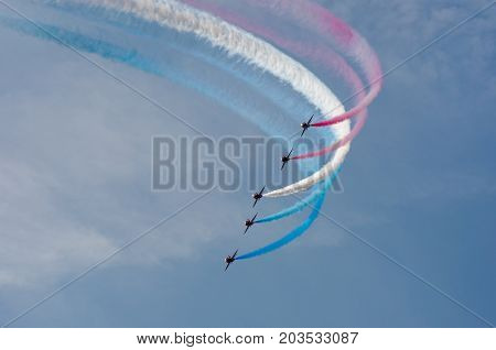 Clacton Essex United Kingdom -25 August 2017: Red arrows display team flying in formation over Clacton in annual free air display