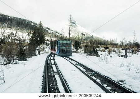 Funicular railway at High Tatras mountains in Slovak republic. Rail cable car leads from Stary Smokovec to ski and tourist resort Hrebienok.