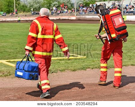 Ambulance stuff on the sport track with equipments