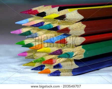 a collection of colored pencils whose edges have been pointed