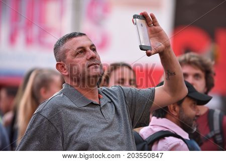 NEW YORK CITY - AUG. 26 : Unidentified people on the Times Square in Manhattan on August 26 2017 in New York City NY. Times Square is a major tourist destination and entertainment center.