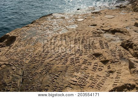 Carved And Engraved Names In The Rock