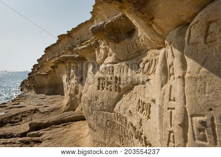 Carved And Engraved Names In The Rock
