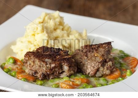 closeup of bavarian homemade meatballs with mashed potato
