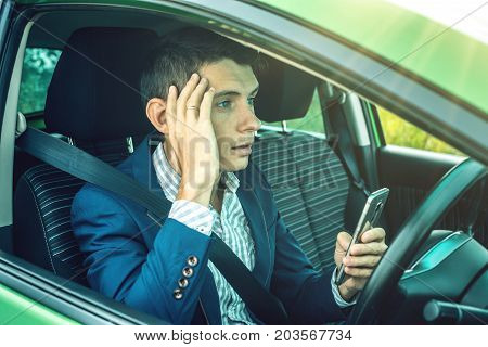 Driver Man With A Phone In Hands Makes An Accident. Fright, Inconsiderate And Dangerous Driving. The