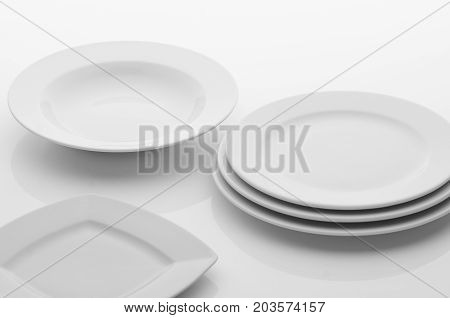 kitchen and restaurant utensils plates on a light background