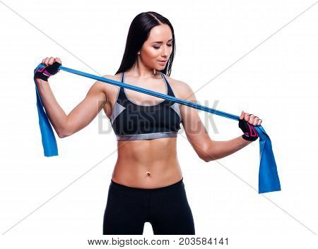 Fitness Girl Performs Exercises With Resistance Band. Attractive Young Woman Doing Exercises With Ex
