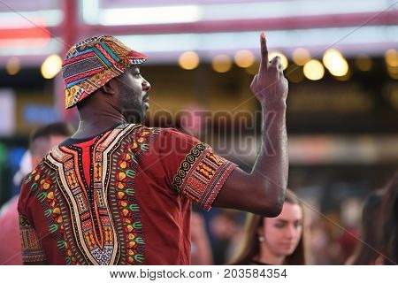 NEW YORK CITY - AUG. 26 : Unidentified people on the Times Square in Manhattan on August 26 2017 in New York City NY. Times Square is a major tourist destination and entertainment center.