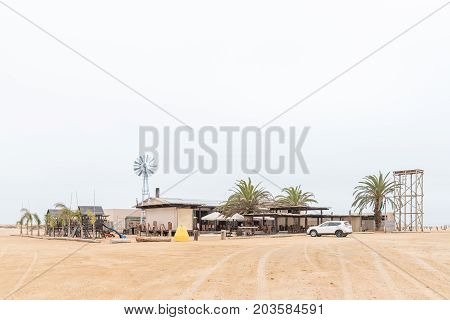 SWAKOPMUND NAMIBIA - JUNE 29 2017: Windpomp 14 (windmill 14) a camping site and restaurant in the Namib Desert to the North of Swakopmund on the Skeleton Coast of Namibia