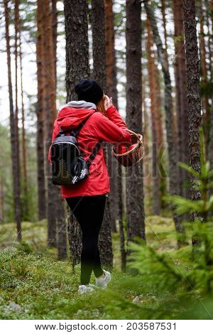 Young Woman In Red Jacket Enjoying Nature In Forest. Latvia