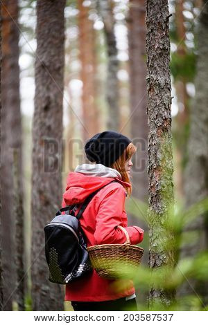 Young Woman In Red Jacket Enjoying Nature In Forest. Latvia