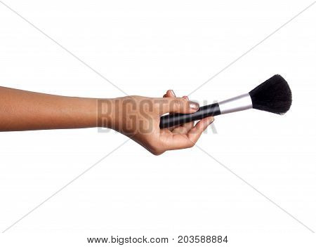 Women's hand with cosmetic accessories - powderbrush