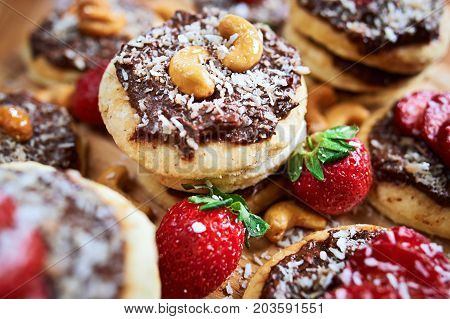 Vegan Homemade Coconut Cookies With Strawberries And Chocolate Nut Toping, Close Up