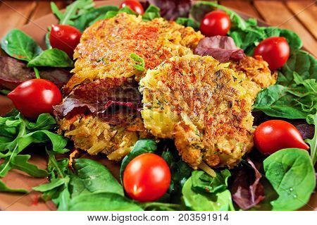 Homemade Veg Burgers From Potatoes And Lentils, Served On A Plate With Tomatoes And Green Salad On A