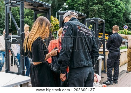 Voronezh, Russia - September 8, 2017: Security guards near metal detectors in a public place on a city holiday, Voronezh, Dynamo Park