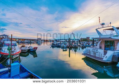 TAIPEI TAIWAN - JULY 05: This is an evening view of the docks in the fisherman's whard area of Tamsui a popular landmark amongst tourists and locals on July 05 2017 in Taipei