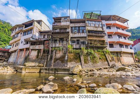 Riverside architecture and nature in Shiding street