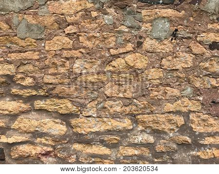 Close Up Of Eathered Stained Old Brick Wall Background