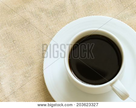 Close ulp of a cup of black coffee.