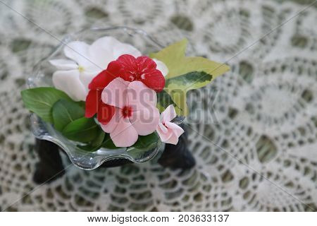 Tablecloth of the decoration and the lacework of the flower on the table