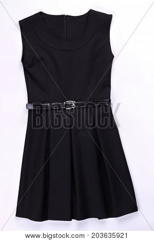 Beautiful black belted pleated dress. Classic pleated black dress isolated on white. Black dress with pleats on sale.