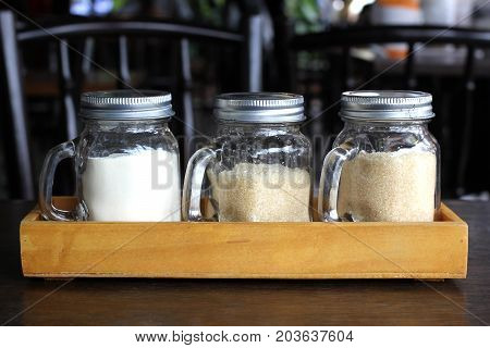 Sugar And Creamer In Glass Bottle
