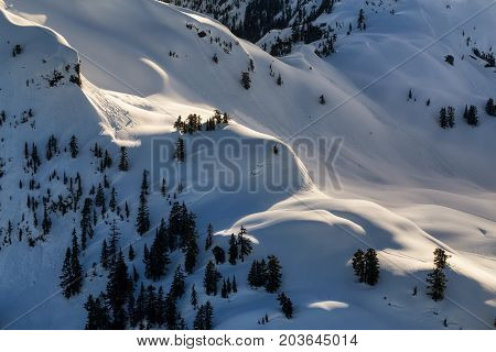 Aerial landscape view of the snow covered mountain range North of Vancouver British Columbia Canada.
