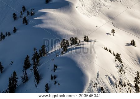 Aerial landscape view of the snow covered mountain range North of Vancouver British Columbia Canada.