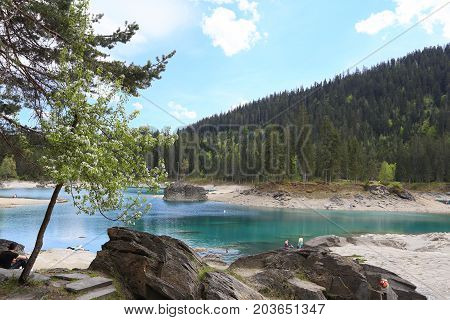 FLIMS, SWITZERLAND - MAY 22, 2016: Lake Caumasee on May 22, 2016 in Flims, Switzerland. It is a popular resort in the Grisons near Chur.