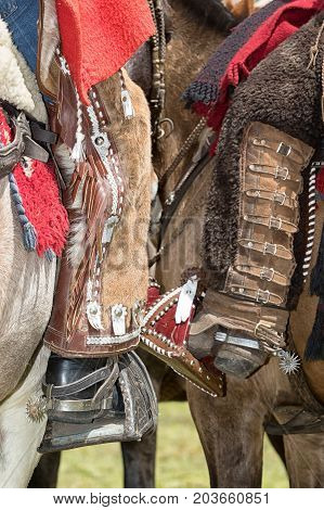 June 10 2017 Toacazo Ecuador: foot of local cowboys equipped for rodeo with chaps and spurs