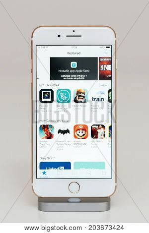 PARIS FRANCE - SEP 26 2016: New Apple iPhone 7 Plus in docking station after unboxing and testing by installing and running the AppStore apple Store