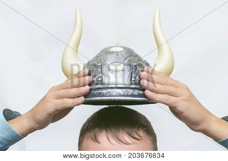 Stock broker. Bull speculation concept. Agressive business strategy. Business man holding a bull hat with horns above his head. Best stock trader.