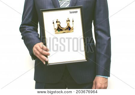 Top manager award mockup. Best office employee award. Business man holding in hands empty blank photo frame with gold crown image with copy space for image. Gratitude concept. Grateful letter.