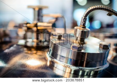 Metal flanges with flexible nipples. Abstract industrial background.