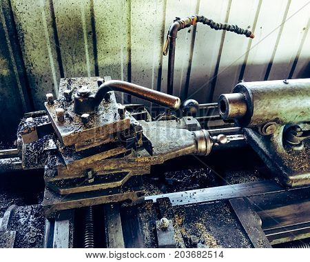 close up photo of old metal lathe.
