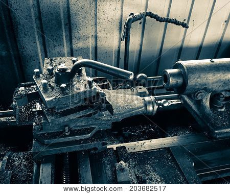 close up photo of old metal lathe.