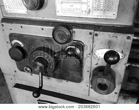 close up photo of old metal lathe.