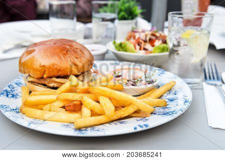 Burger And Chips With Coleslow Salad