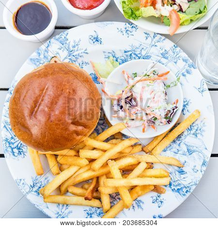 Burger And Chips With Coleslow Salad