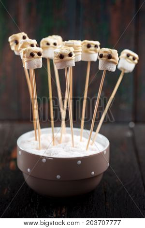 Halloween Lolipopes like mumi. Dessert for Halloween