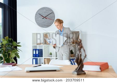 Female Lawyer With Folder Of Documents