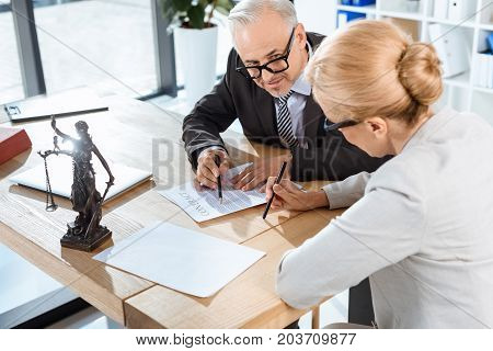 Colleagues Discussing Contract