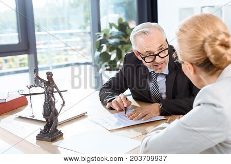Colleagues Discussing Contract