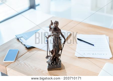Lawyer Workplace With Themis Sculpture