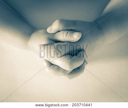close up photo of praying child hands.