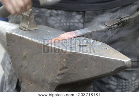 Blacksmith Wotk With Hammer And Hot Iron