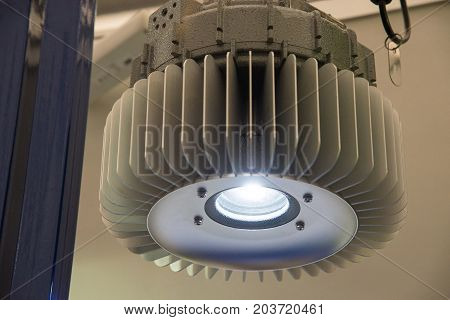 Industrial explosion-proof lantern of black and gray shines with white light at coal mining exhibition